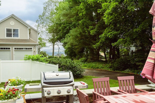 92 Grove Beach Rd S, Westbrook, CT 06498 - view of patio / terrace with area for grilling and a garage