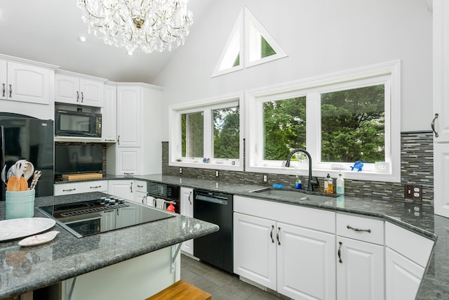 92 Grove Beach Rd S, Westbrook, CT 06498 - kitchen with black appliances, tasteful backsplash, vaulted ceiling, white cabinetry, and a chandelier