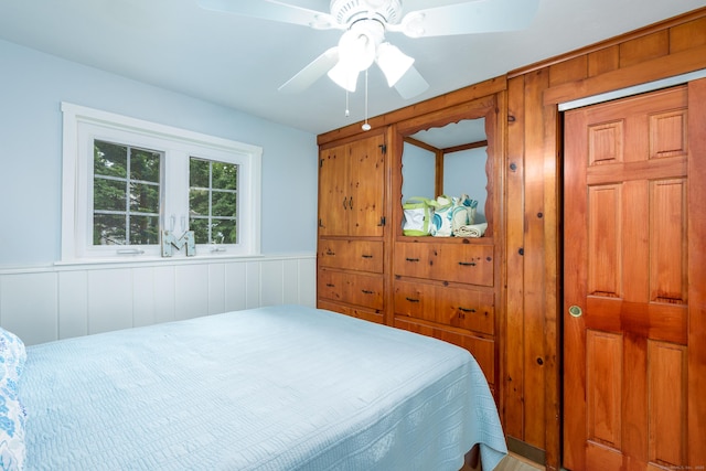 92 Grove Beach Rd S, Westbrook, CT 06498 - bedroom with wainscoting and ceiling fan
