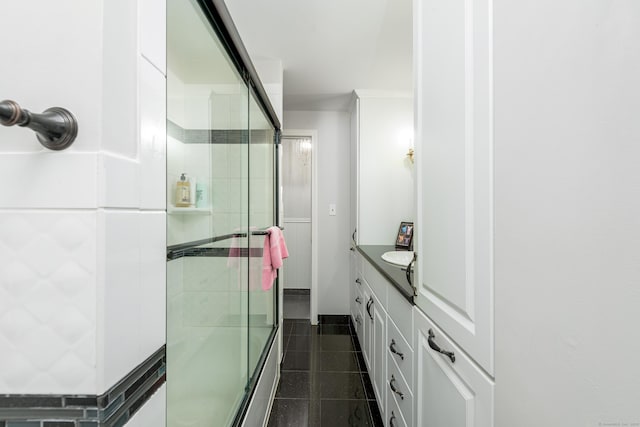 92 Grove Beach Rd S, Westbrook, CT 06498 - bathroom featuring tiled shower, vanity, and tile patterned floors