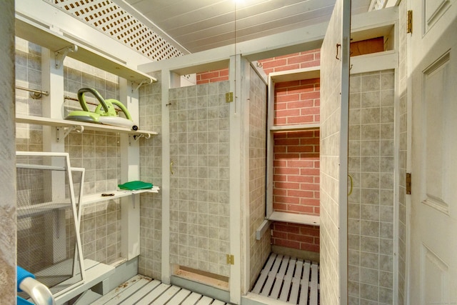 92 Grove Beach Rd S, Westbrook, CT 06498 - bathroom featuring tile walls and a shower stall