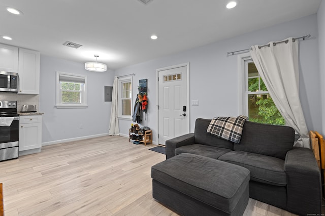 5 Fuller Ct, East Lyme, CT 06357 - living room with light wood-style floors, recessed lighting, and electric panel
