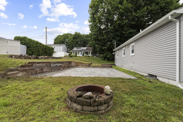 5 Fuller Ct, East Lyme, CT 06357 - view of grassy yard featuring a fire pit and a patio