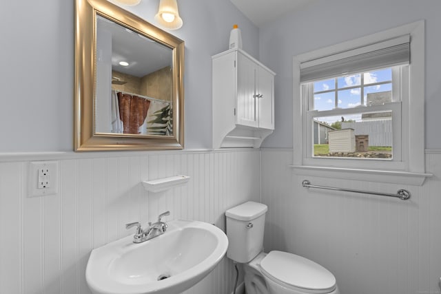 5 Fuller Ct, East Lyme, CT 06357 - bathroom with wainscoting and a shower with curtain