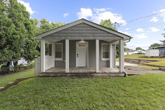 5 Fuller Ct, East Lyme, CT 06357 - bungalow featuring covered porch and a front yard