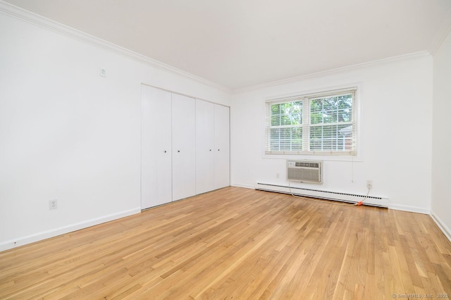 1197 Hope St Apt 7, Stamford, CT 06907 - unfurnished bedroom featuring baseboard heating, light wood finished floors, ornamental molding, a wall mounted air conditioner, and a closet