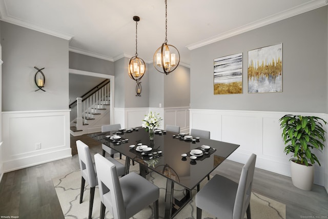 98A Tower Rd, Brookfield, CT 06804 - dining area featuring stairs, crown molding, a decorative wall, wood finished floors, and wainscoting