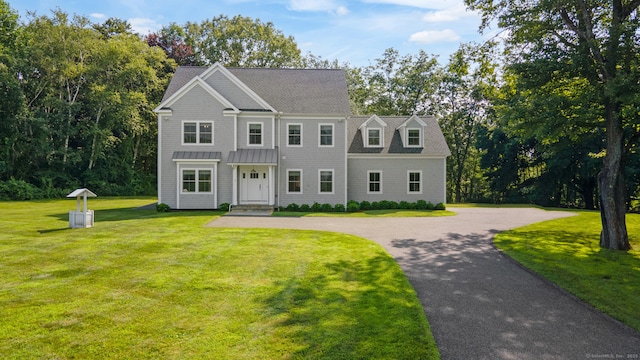 98A Tower Rd, Brookfield, CT 06804 - view of front of house with a front yard, curved driveway, roof with shingles, and a standing seam roof