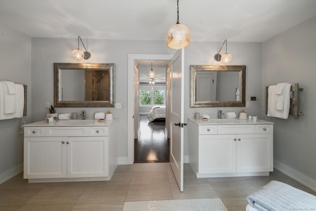 98A Tower Rd, Brookfield, CT 06804 - full bathroom featuring two vanities, connected bathroom, a ceiling fan, and a shower
