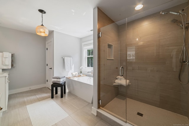 98A Tower Rd, Brookfield, CT 06804 - full bath with a soaking tub, a shower stall, vanity, recessed lighting, and tile patterned floors