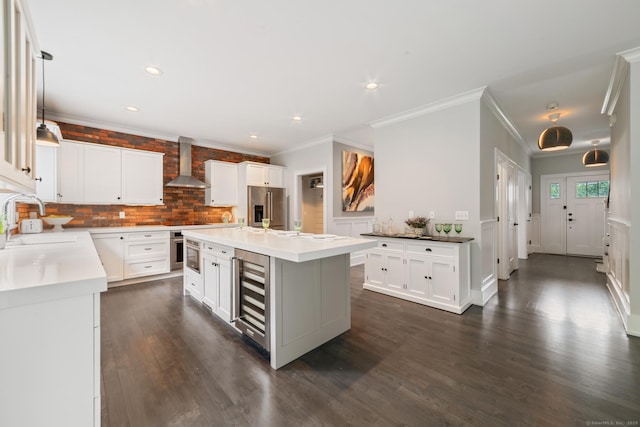 98A Tower Rd, Brookfield, CT 06804 - kitchen featuring beverage cooler, stainless steel appliances, wall chimney range hood, tasteful backsplash, and crown molding