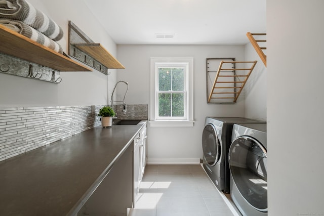 98A Tower Rd, Brookfield, CT 06804 - laundry area with washer and dryer, cabinet space, and light tile patterned floors