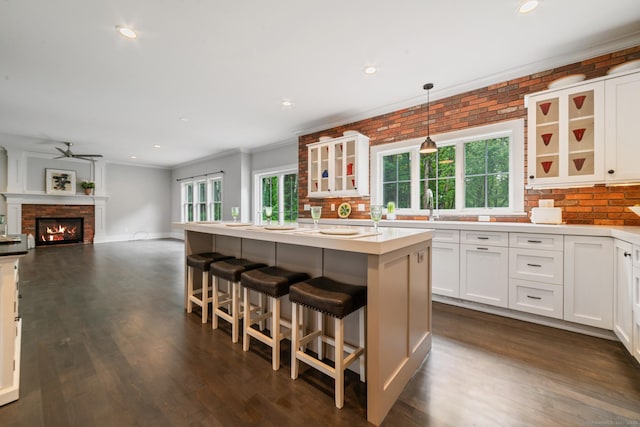 98A Tower Rd, Brookfield, CT 06804 - kitchen featuring a ceiling fan, decorative backsplash, white cabinets, ornamental molding, and recessed lighting
