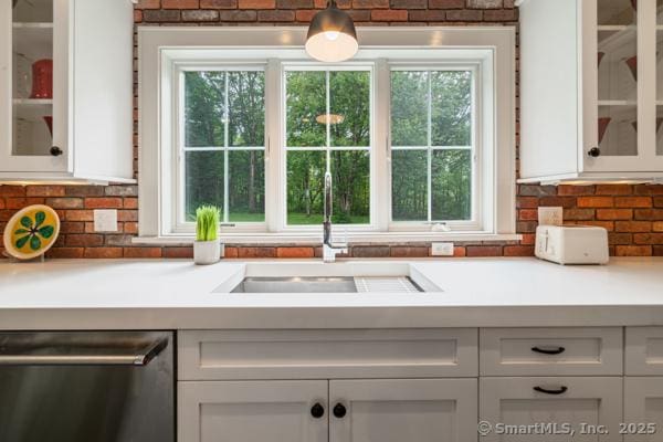 98A Tower Rd, Brookfield, CT 06804 - kitchen with dishwasher, white cabinetry, light countertops, and healthy amount of natural light