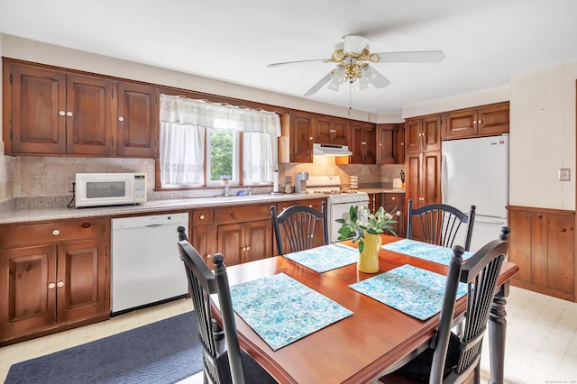 46 W St, Shelton, CT 06484 - kitchen featuring white appliances, under cabinet range hood, ceiling fan, light countertops, and backsplash