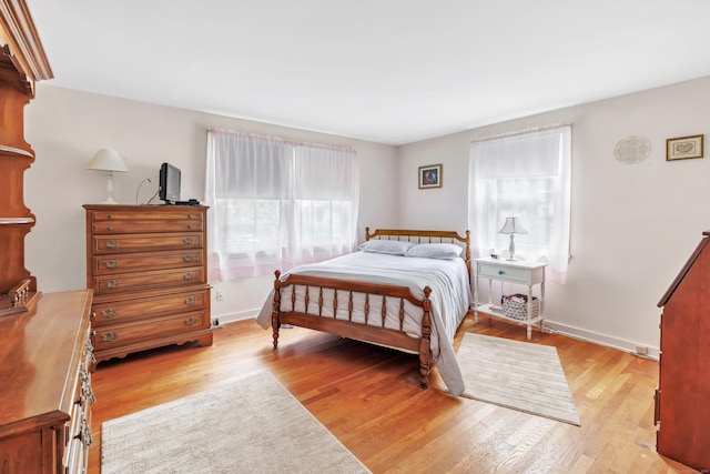 46 W St, Shelton, CT 06484 - bedroom with multiple windows and wood finished floors