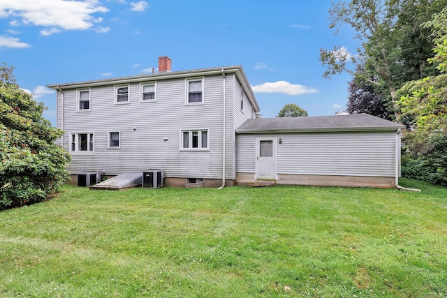 46 W St, Shelton, CT 06484 - back of property with a lawn and a chimney