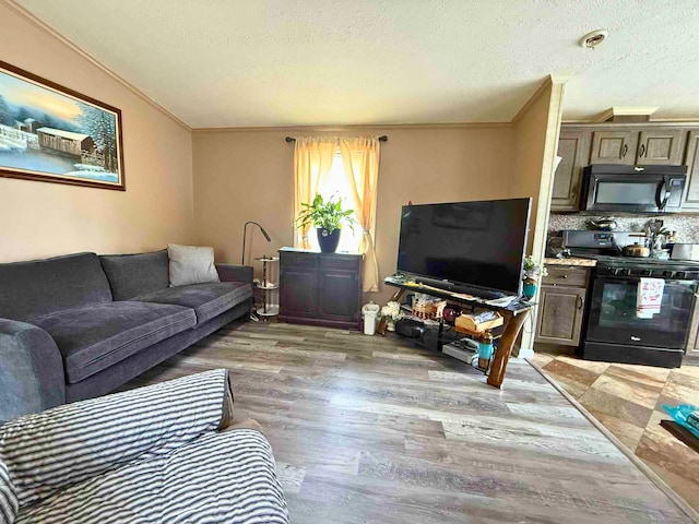 441 Main St Lot 1005, East Hartford, CT 06111 - living room featuring crown molding, light wood-type flooring, and a textured ceiling