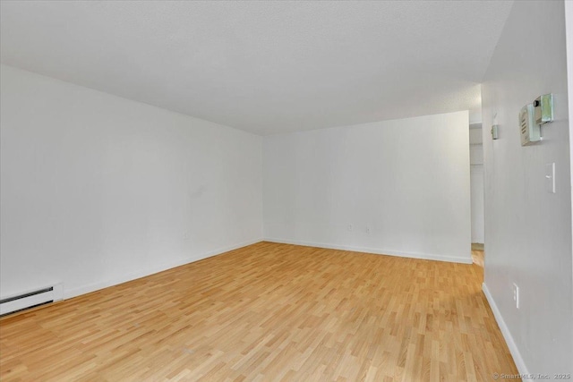 142 Burgundy Hill Ln Unit 142, Middletown, CT 06457 - unfurnished room featuring light wood-type flooring and a baseboard heating unit