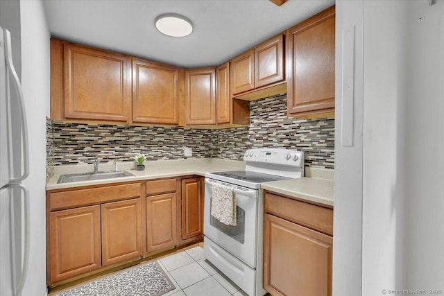142 Burgundy Hill Ln Unit 142, Middletown, CT 06457 - kitchen with white appliances, light tile patterned flooring, decorative backsplash, and light countertops
