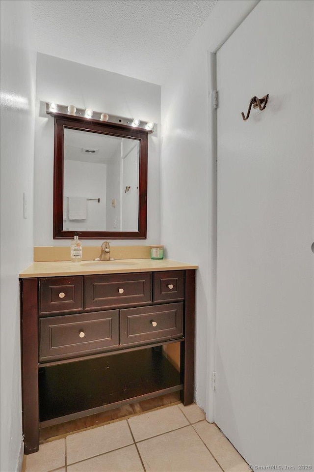 142 Burgundy Hill Ln Unit 142, Middletown, CT 06457 - bathroom with vanity, tile patterned floors, and a textured ceiling