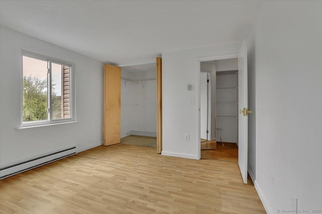 142 Burgundy Hill Ln Unit 142, Middletown, CT 06457 - unfurnished bedroom with light wood-style floors, a baseboard radiator, and a closet