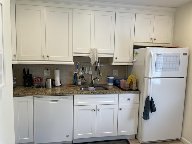 2289 Bedford St Unit A6, Stamford, CT 06905 - kitchen with white appliances, white cabinets, tasteful backsplash, and dark stone counters