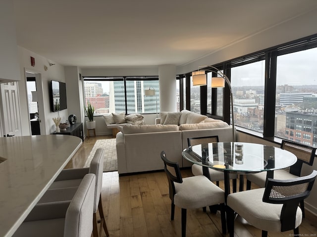 127 Greyrock Pl Apt 1401, Stamford, CT 06901 - dining space with light wood-style flooring and a city view