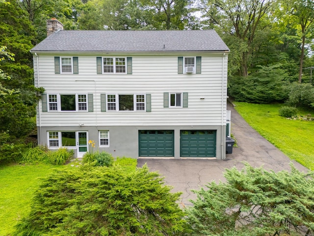 226 Stanwich Rd, Greenwich, CT 06830 - view of front of property featuring asphalt driveway, a garage, and a chimney