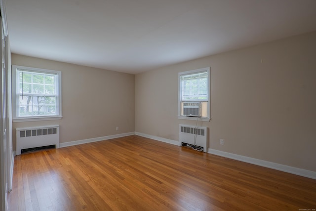 226 Stanwich Rd, Greenwich, CT 06830 - spare room featuring radiator and light wood finished floors