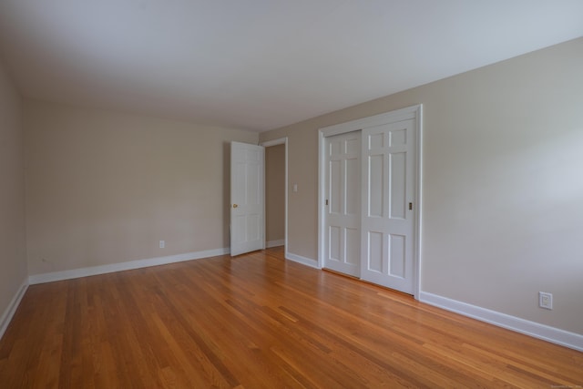 226 Stanwich Rd, Greenwich, CT 06830 - unfurnished bedroom with light wood finished floors and a closet