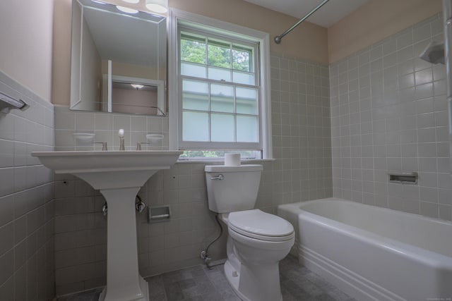 226 Stanwich Rd, Greenwich, CT 06830 - full bathroom featuring tile walls, healthy amount of natural light,  shower combination, and tile patterned floors
