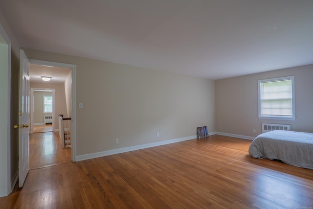 226 Stanwich Rd, Greenwich, CT 06830 - bedroom with wood finished floors and radiator