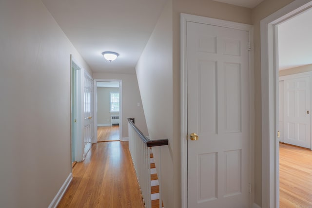 226 Stanwich Rd, Greenwich, CT 06830 - corridor featuring an upstairs landing, light wood-style floors, and radiator