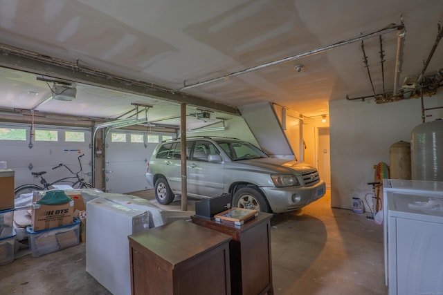 226 Stanwich Rd, Greenwich, CT 06830 - garage featuring washer / dryer and a garage door opener