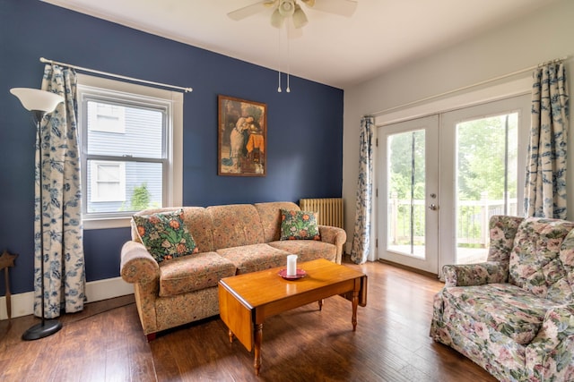 47 Silver St, Middletown, CT 06457 - living room featuring radiator heating unit, hardwood / wood-style floors, a ceiling fan, and french doors