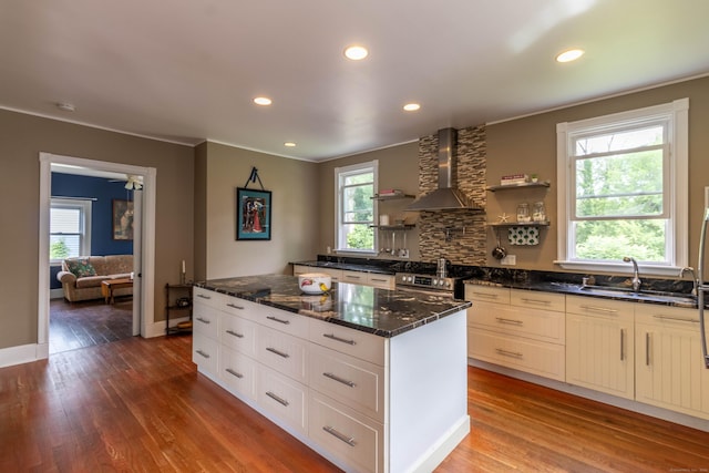 47 Silver St, Middletown, CT 06457 - kitchen featuring wall chimney range hood, stainless steel range oven, wood finished floors, healthy amount of natural light, and recessed lighting
