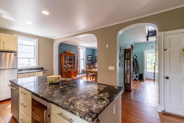 47 Silver St, Middletown, CT 06457 - kitchen featuring wine cooler, freestanding refrigerator, arched walkways, dark wood-style floors, and recessed lighting
