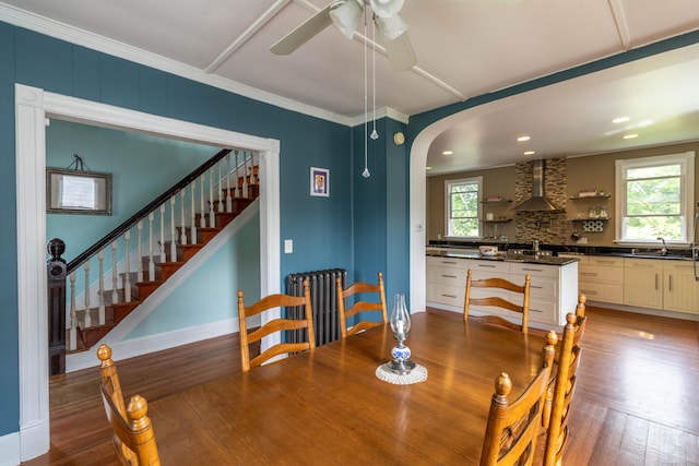 47 Silver St, Middletown, CT 06457 - dining room with healthy amount of natural light, wood finished floors, arched walkways, ornamental molding, and recessed lighting