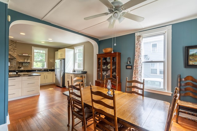 47 Silver St, Middletown, CT 06457 - dining area with arched walkways, a ceiling fan, light wood-type flooring, recessed lighting, and crown molding
