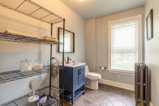 47 Silver St, Middletown, CT 06457 - bathroom with radiator, vanity, and tile patterned floors