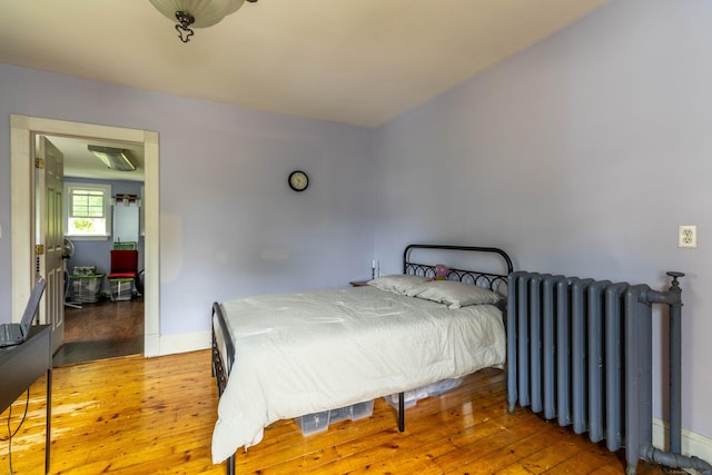 47 Silver St, Middletown, CT 06457 - bedroom with radiator and wood-type flooring