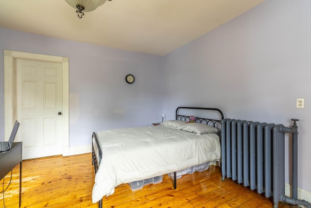 47 Silver St, Middletown, CT 06457 - bedroom with radiator and wood-type flooring