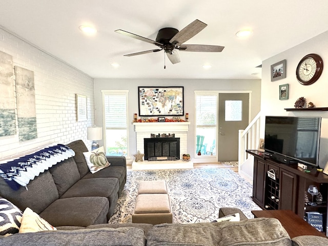 85 Viscount Dr Unit 4E, Milford, CT 06460 - living room featuring ceiling fan, a fireplace, stairway, and recessed lighting