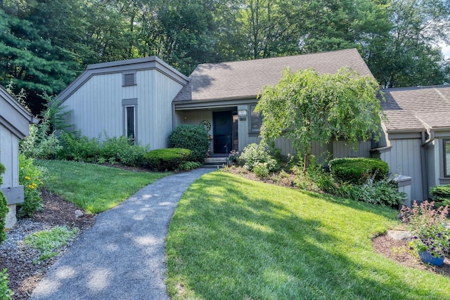 583 Heritage Vlg Unit A, Southbury, CT 06488 - view of front of home with a front yard and roof with shingles