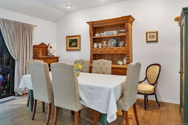 583 Heritage Vlg Unit A, Southbury, CT 06488 - dining room with wood finished floors and vaulted ceiling