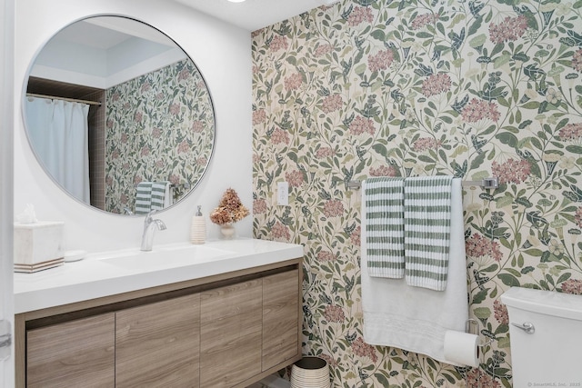583 Heritage Vlg Unit A, Southbury, CT 06488 - bathroom featuring wallpapered walls and vanity