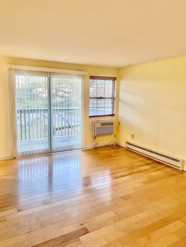 4 Heather Rdg Unit 4, Shelton, CT 06484 - unfurnished room featuring a baseboard heating unit and light wood-type flooring