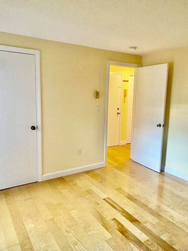 4 Heather Rdg Unit 4, Shelton, CT 06484 - unfurnished room featuring light wood-type flooring and a textured ceiling
