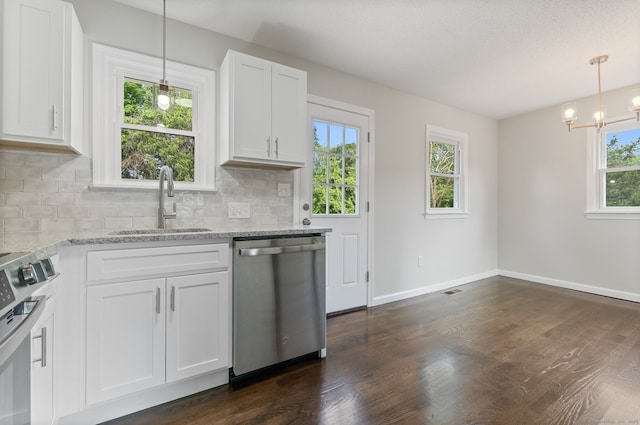 231 Lincolndale Dr, Waterbury, CT 06704 - kitchen with stainless steel appliances, dark wood-style flooring, backsplash, light stone countertops, and white cabinetry